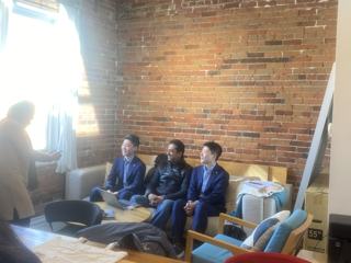 Participants listening together in a meeting room.